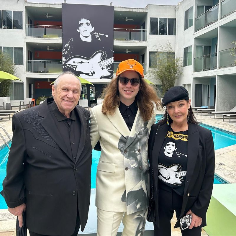 Ionia County-bred bluegrass guitarist Billy Strings (center) poses for a photo with his parents before the 2024 Grammy Awards in Los Angeles.