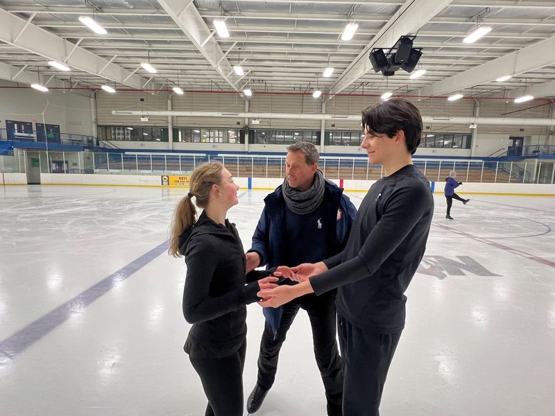 Ice dancers Jasmine Robertson and Cooper Cornwell with their coach, Igor Shpilband at Novi Ice Arena on March 18, 2024.