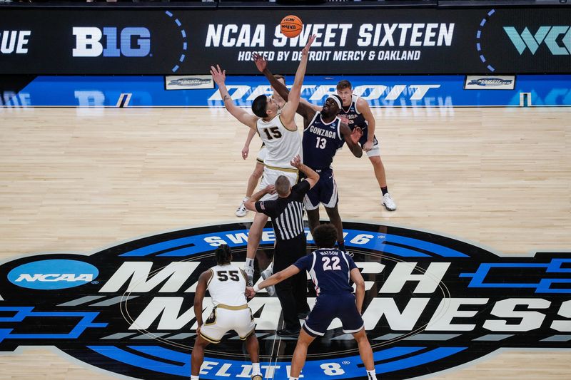 Purdue center Zach Edey (15) and Gonzaga forward Graham Ike (13) battle for the tipoff during the first half of the NCAA tournament Midwest Regional Sweet 16 round at Little Caesars Arena in Detroit on Friday, March 29, 2024.