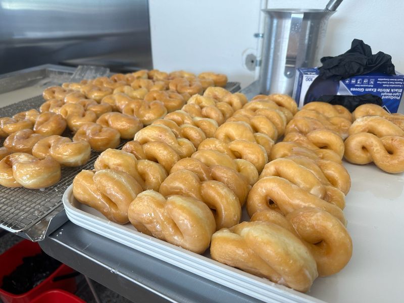 Twisted and glazed doughnuts sit on a tray ready for customers on Saturday morning, May 4, 2024 at Dutch Girl Donuts in Detroit.