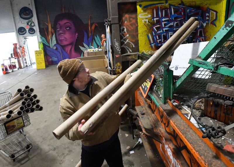 Will Taylor of Detroit recycles cardboard dowels at 'Recycle Here!,' city of Detroit's neighborhood recycling program in Detroit, Michigan on April 18, 2022.