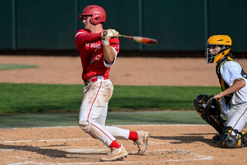 St. Johns' Logan Keilen gets a double against Grand Ledge in the third inning on Tuesday, May 21, 2024, during the Diamond Classic at MSU's McLane Stadium in East Lansing