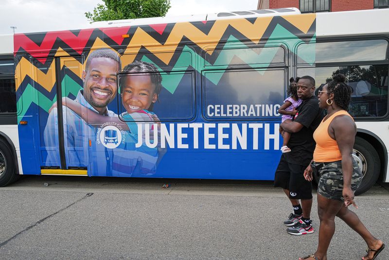 A CATA bus with a Juneteenth mural is on display and running air conditioning at the annual 517 Juneteenth Festival in Lansing's REO Town Saturday, June 15, 2024.