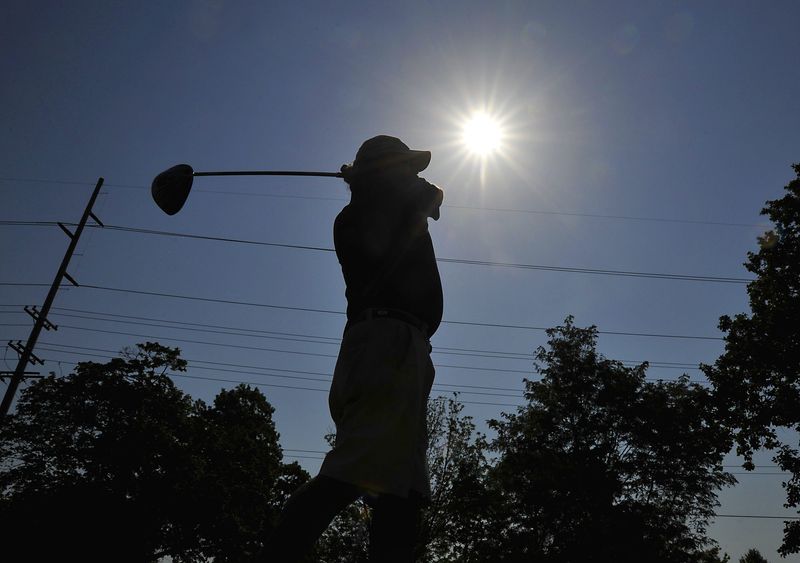 The sun beats down as Tom Bernitt gets in 18 holes in the extreme heat at Groesbeck Golf Course in Lansing in 2012.
