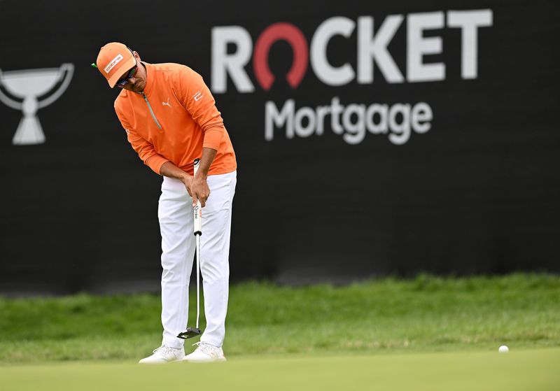 Rickie Fowler watches his putt on the 18th green in the final round of the Rocket Mortgage Classic at the Detroit Golf Club in Detroit on June 30, 2024.