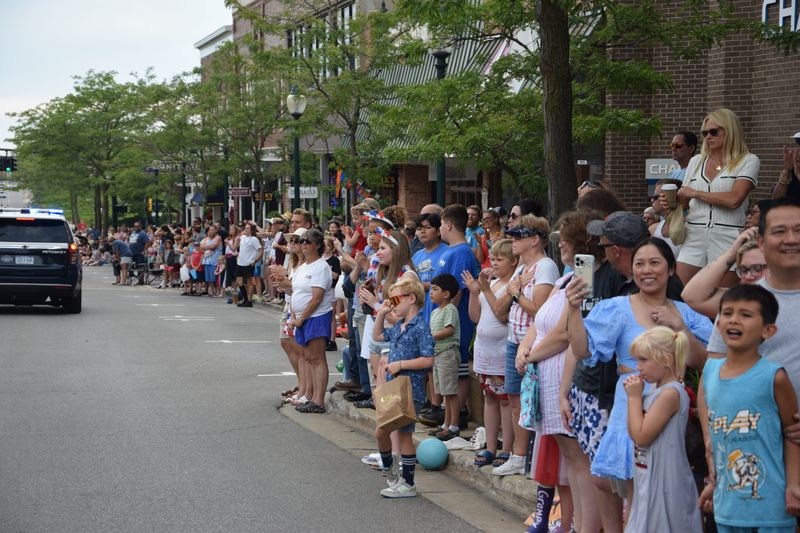 People line the streets in downtown Petoskey for the annual Fourth of July parade.