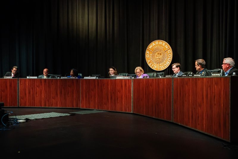 From left, Warren City Council members Gary Boike, Henry Newnan, Melody Magee, Angela Rogensues, Mindy Moore, Jeffrey Schroder (the council's attorney), Jonathan Lafferty and Dave Dwyer attend a special meeting of the council on Thursday, July 25, 2024 in Warren.
