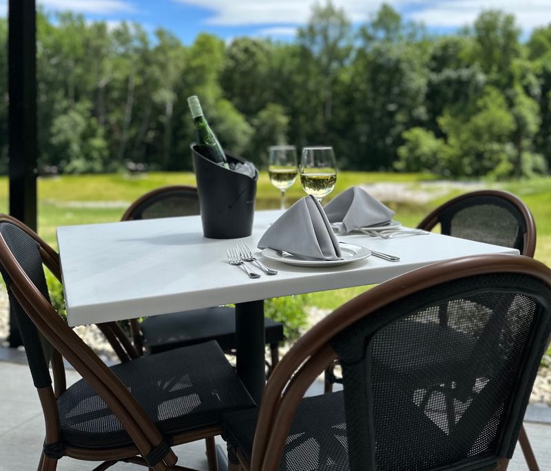 HorseFeathers Kitchen and Cocktails is a scenic restaurant attached to an elegant event center in the former Girl Scout Camp Innisfee.