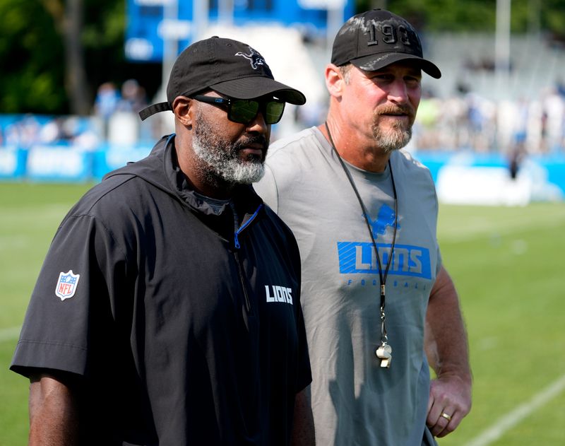 Detroit Lions executive vice president and general manager Brad Holmes, left, and Lions head coach Dan Campbell head off the practice field at the team's training facility in Allen Park on Wednesday, Aug. 14, 2024.
