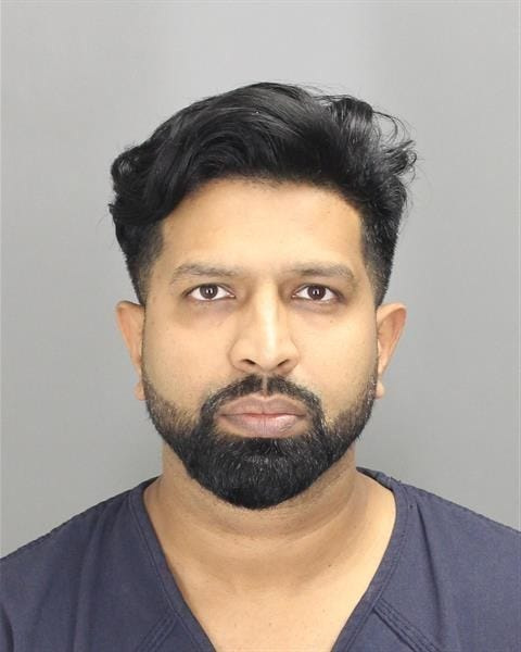 Dr. Oumair Aejaz is facing charges that he recorded nude images of women and children.