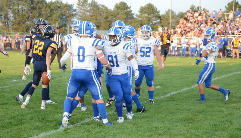 Erhan Gurriel is congratulated by his Gibraltar Carlson teammates after a tackle for loss against Airport on Thursday, Aug. 29, 2024.