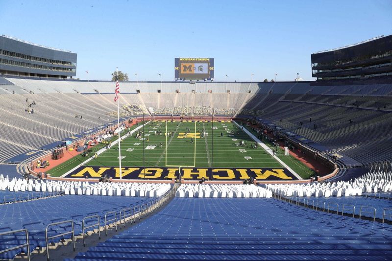 The Big House would normally be teeming with fans for one of the biggest rivalries in Big Ten football, but instead an empty Michigan Stadium dotted with cardboard cutouts greets players before the Michigan State-Michigan game in Ann Arbor on Oct. 31, 2020.