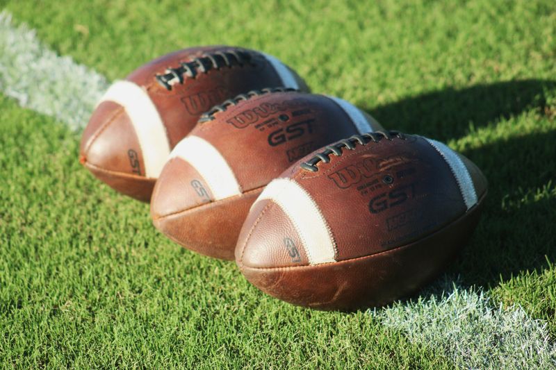 STOCK | Footballs are displayed on the field before a high school football game between Nease and Creekside in St. Johns, Florida, on August 30, 2024. [Clayton Freeman/Florida Times-Union]