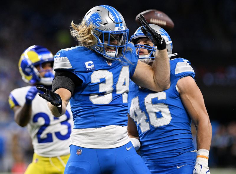 Lions linebacker Alex Anzalone (34) reacts with Jack Campbell (46) after tackling Rams running back Kyren Williams in the first quarter.