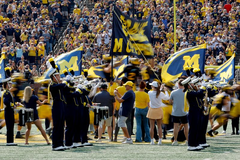 Michigan Wolverines players take the field before a game against the Arkansas State Red Wolves at Michigan Stadium in Ann Arbor on Saturday, Sept. 14, 2024.