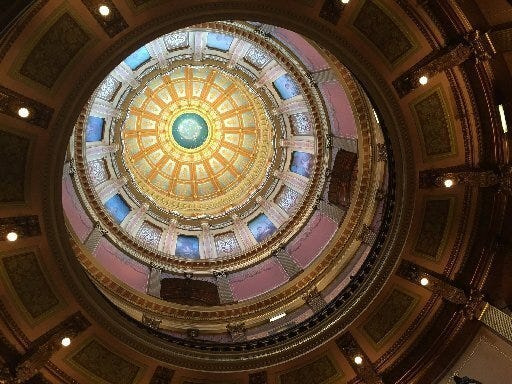 An inside view of the dome in the rotunda of the state Capitol building in Lansing, Michigan.