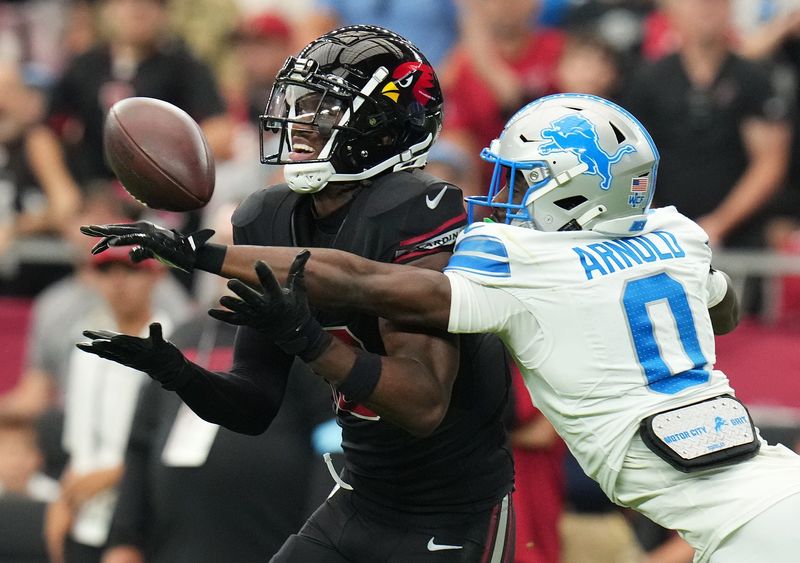 Arizona Cardinals receiver Marvin Harrison Jr. tries to catch the ball as Detroit Lions cornerback Terrion Arnold deflects it away at State Farm Stadium on Sunday, Sept. 22, 2024 in Glendale, Arizona.