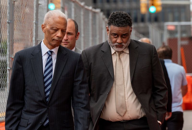 William Smith, right, former CFO of the Detroit Riverfront Conservancy, walks outside the U.S. District Court with his attorney after being arraigned in federal court in Detroit on Thursday, Sept. 26, 2024.