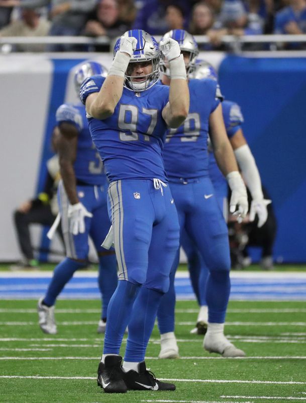 Detroit Lions defensive end Aidan Hutchinson (97) dances after sacking Minnesota Vikings quarterback Kirk Cousins (8) during second half action Sunday, December 11, 2022.