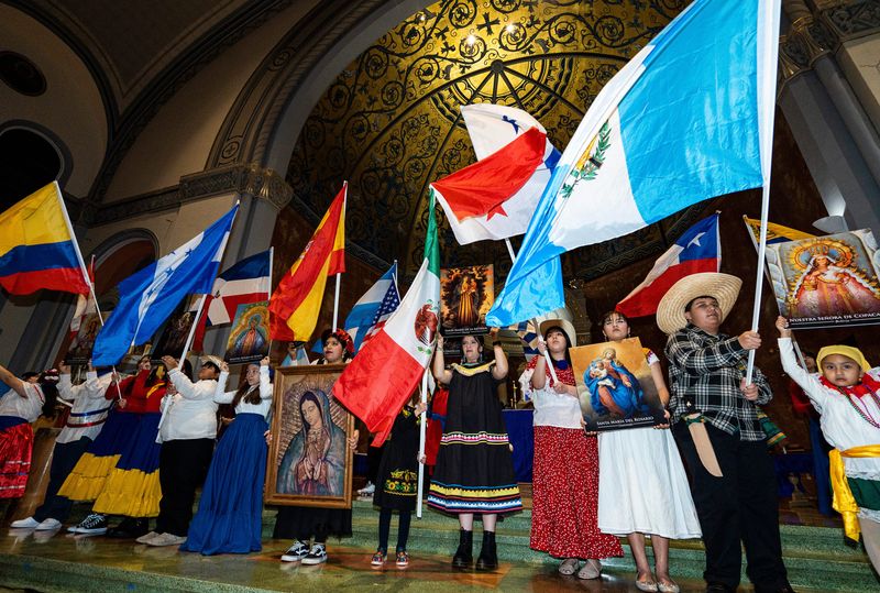 Students carry flags from Latin American countries to celebrate the Feast of Our Lady of Guadalupe December 11, 2023 at St. Adalbert Parish in Milwaukee


Jovanny Hernandez / Milwaukee Journal Sentinel