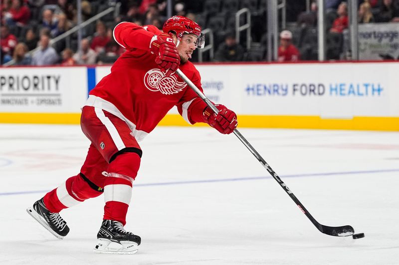 Detroit Red Wings right wing Vladimir Tarasenko (11) shoots the puck against Toronto Maple Leafs during the third period of a preseason game at Little Caesars Arena in Detroit on Thursday, Oct. 3, 2024.