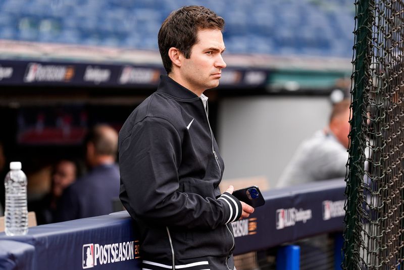 Detroit Tigers president of baseball operations Scott Harris watches warm up before Game 2 of ALDS at Progressive Field in Cleveland, Ohio on Monday, Oct. 7, 2024.