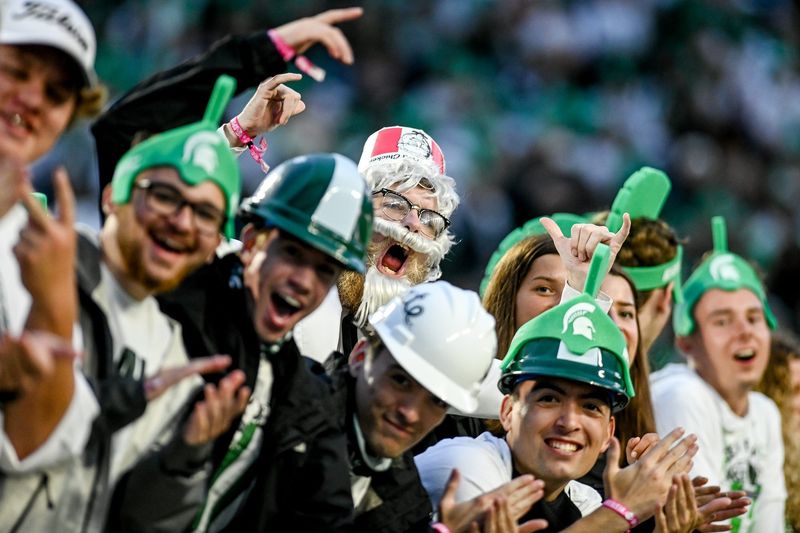 Michigan State Colonel Sanders cheers with other Spartans fans before MSU's football game against Western Kentucky on Saturday, Oct. 2, 2021, at Spartan Stadium in East Lansing.

211002 Msu Wku Fb 020a