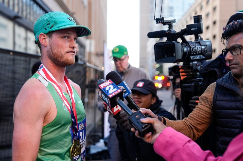 Marathon male winner Andy Bowman, of Ferndale, is interviewed by reporters during the 47th annual Detroit Free Press Marathon presented by MSU Federal Credit Union in Detroit on Sunday, Oct. 20, 2024.during the 47th annual Detroit Free Press Marathon presented by MSU Federal Credit Union in Detroit on Sunday, Oct. 20, 2024.