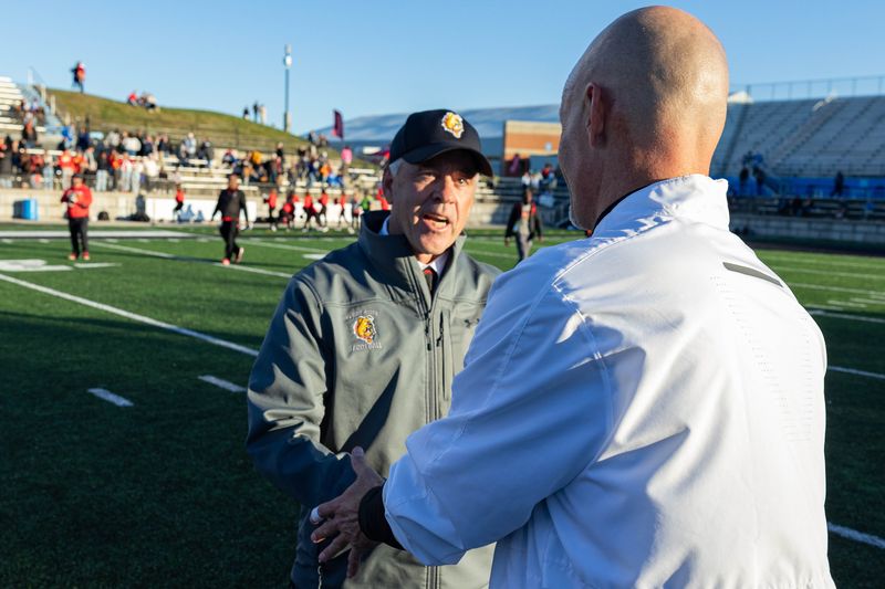 Ferris State's Coach Tony Annese shakes hands with GVSU's Coach Scott Wooster after Ferris State beats GVSU at Lubbers Field on Saturday, October. 26.