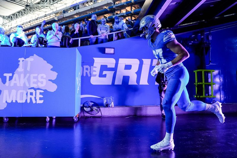 Detroit Lions tight end Sam LaPorta runs out of the tunnel during player introductions before the start of the game against the Tennessee Titans at Ford Field in Detroit on Sunday, Oct. 27, 2024.
