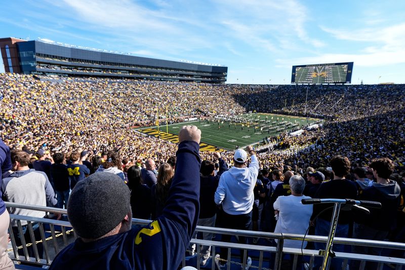 Michigan fans cheer as the school's marching band performs before the Oregon football game at Michigan Stadium in Ann Arbor on Saturday, Nov. 2, 2024.