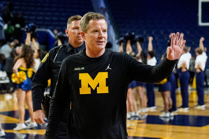 Michigan head coach Dusty May waves at fans after 101-53 win over Cleveland State at Crisler Center in Ann Arbor on Monday, Nov. 4, 2024.