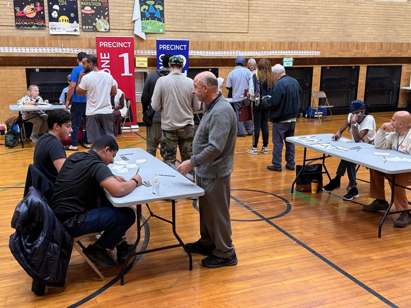 Voters in line to pick up their ballots Tuesday, Nov. 5, 2024, at McDonald Elementary School in Dearborn.
