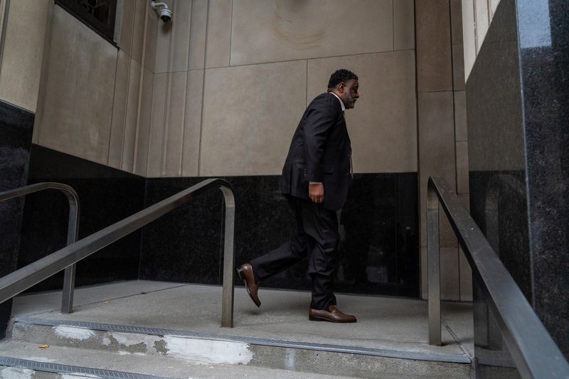 William Smith, former CFO of the Detroit Riverfront Conservancy, walks outside U.S. District Court in Detroit before his plea hearing on Friday, Nov. 15, 2024.