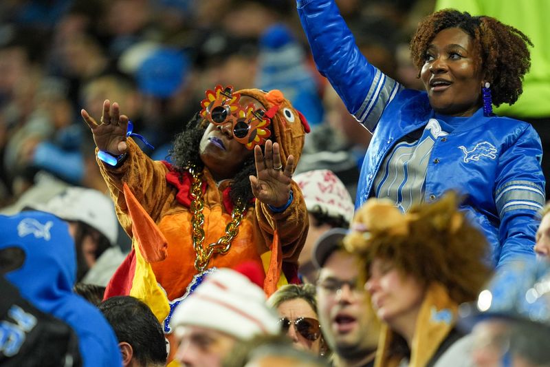 Detroit Lions fans cheer for their team on Thanksgiving Day at Ford Field in Detroit on Thursday, Nov. 28, 2024.