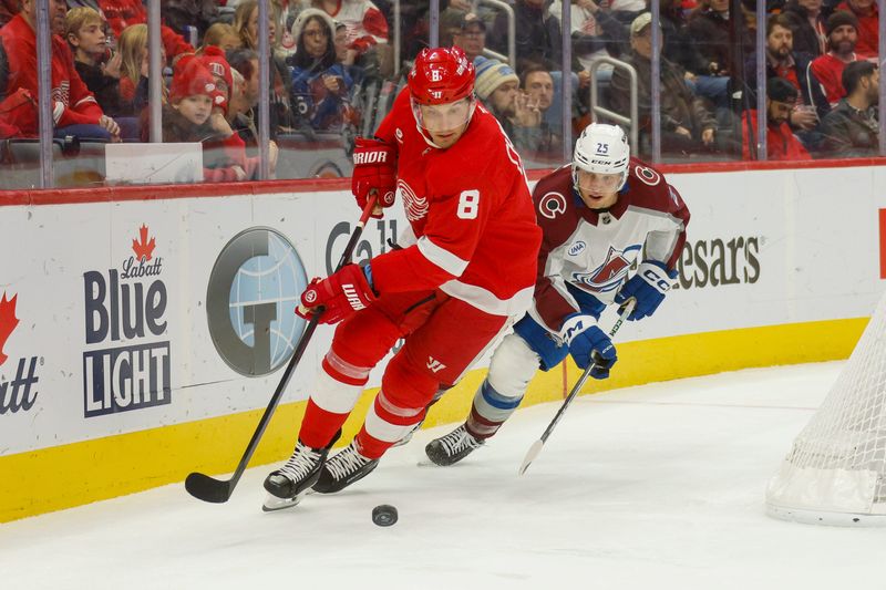 Detroit Red Wings defenseman Ben Chiarot (8) handles the puck against Colorado Avalanche right wing Logan O'Connor (25) during the first period at Little Caesars Arena in Detroit on Saturday, Dec. 7, 2024.