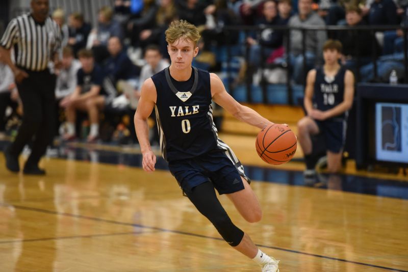 Yale's Jackson Kohler dribbles the ball during a game against Richmond at Richmond High School on Thursday, Dec. 12, 2024.