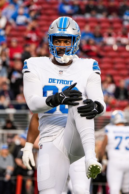 Detroit Lions defensive end Za'Darius Smith stretches during warmups before the game against the San Francisco 49ers at Levi's Stadium in Santa Clara, Calif. on Monday, Dec. 30, 2024.