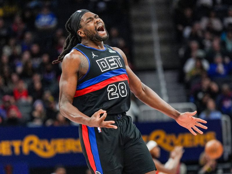 Detroit Pistons center Isaiah Stewart reacts to a teammate's 3-pointer during the first half of an NBA game at Little Caesars Arena in Detroit, Saturday, Jan. 11, 2025.