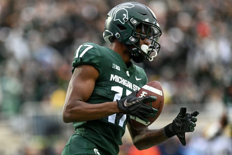 Michigan State's Tre Mosley catches a pass for a 2-point conversion against Michigan during the third quarter on Saturday, Oct. 30, 2021, at Spartan Stadium in East Lansing.

211030 Msu Michigan 167a