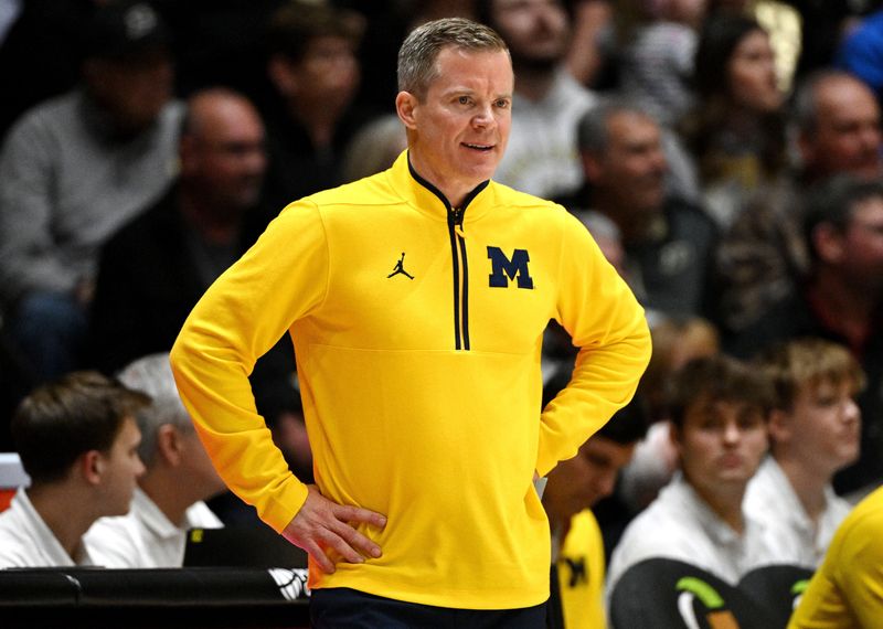 Jan 24, 2025; West Lafayette, Indiana, USA; Michigan Wolverines head coach Dusty May stands on the sideline during the first half against the Purdue Boilermakers at Mackey Arena. Mandatory Credit: Marc Lebryk-Imagn Images