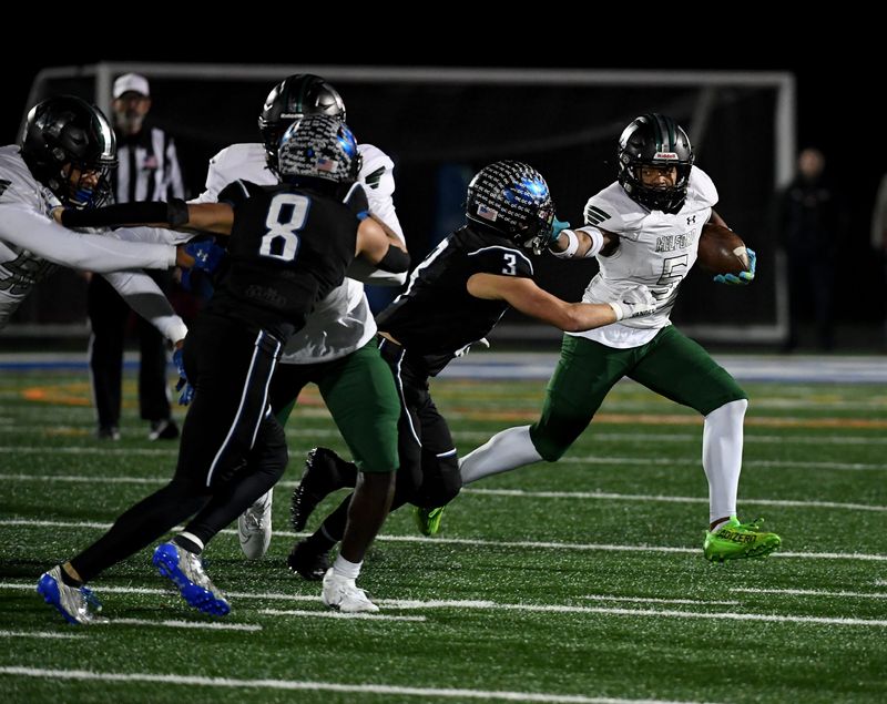 Decatur's Gavin Solito (3) tackles Milford Mill's Damon Ferguson (5) Friday, Nov. 24, 2023, in the 2A State Semifinal in Berlin, Maryland. Decatur defeated Milford Mill 35-34.