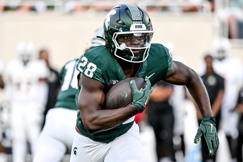 Michigan State's Brandon Tullis runs for a gain against Prairie View A&M during the fourth quarter on Saturday, Sept. 14, 2024, at Spartan Stadium in East Lansing.