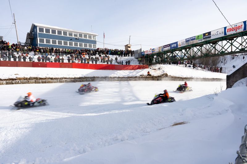 Racers zoom past the crowd during the I-500 on Saturday, Feb. 1, 2025 in Sault Ste. Marie.