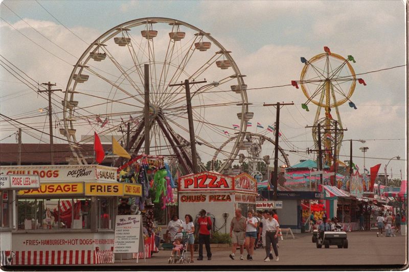 Midway on the Michigan State Fairgrounds in 1998. The state fair struggled in the early 90s, with an all-time low attendance of 163,000 in 1993. By 1999, the fair's attendance rebounded with 458,000 in attendance. It has since moved to the Suburban Collection Showplace in Novi, Michigan.