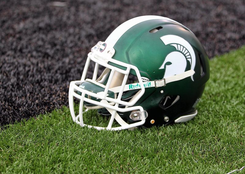 Sep 4, 2015; Kalamazoo, MI, USA; General view of Michigan State Spartans helmet on field prior to a game against Western Michigan at Waldo Stadium. Mandatory Credit: Mike Carter-USA TODAY Sports