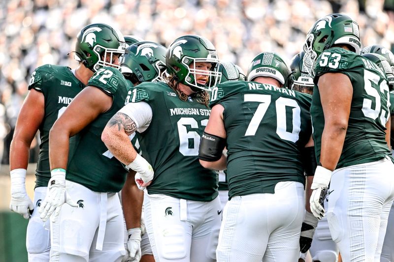 Michigan State's offensive line, from left, Ashton Lepo, Dallas Fincher, Tanner Miller, Luke Newman and Brandon Baldwin huddle up during the fourth quarter in the game against Prairie View A&M on Saturday, Sept. 14, 2024, at Spartan Stadium in East Lansing.
