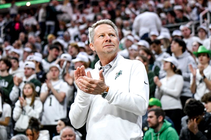 Michigan State president Kevin Guskiewicz claps before the Spartans game against Oregon on Saturday, Feb. 8, 2025, at the Breslin Center in East Lansing.