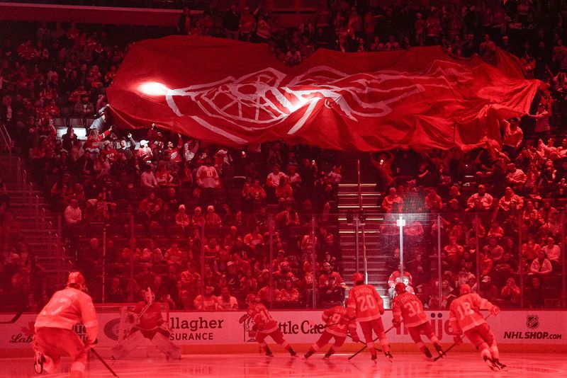Detroit Red Wings fans move a big Red Wings banner across before puck drop against Tampa Bay Lightning at Little Caesars Arena in Detroit on Saturday, Feb. 8, 2025.