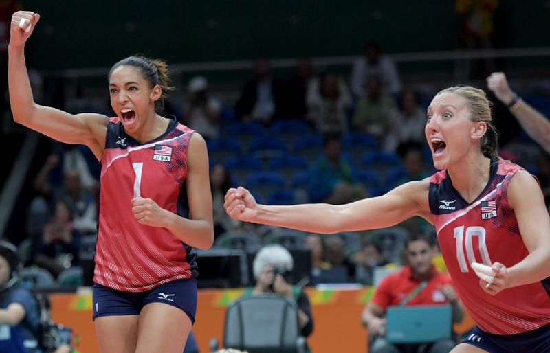 Aug 10, 2016; Rio de Janeiro, Brazil; United States setter Alisha Glass (1) and United States wing spiker Jordan Larson-Burbach (10) celebrate during a volleyball match between USA and Serbia at Maracanazinho in the Rio 2016 Summer Olympic Games. Mandatory Credit: Kirby Lee-USA TODAY Sports